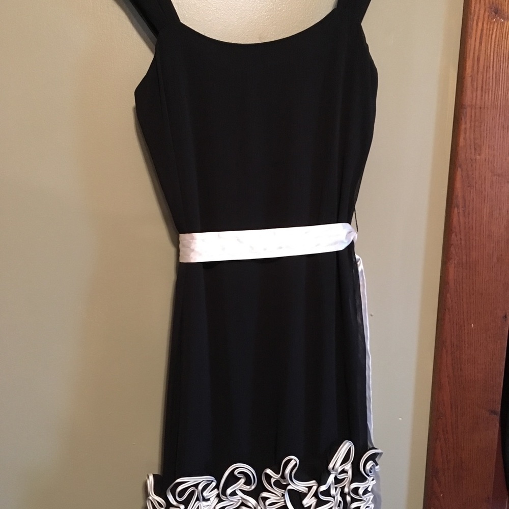 Super sharp black dress with silk belt.